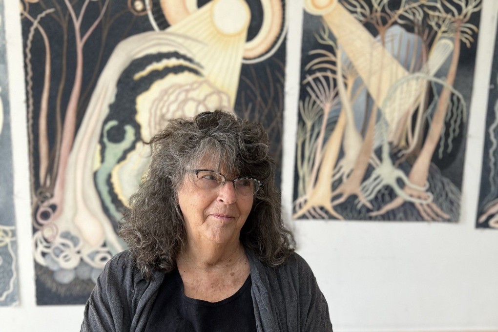 Ann Leda Shapiro sits in front of paintings in her studio on Vashon Island, in the US state of Washington. The artist’s first solo exhibition in Asia, “Ann Leda Shapiro: Body is Landscape”, is being held at the Axel Vervoordt Gallery in Wong Chuk Hang, Hong Kong. Photo: Axel Vervoordt Gallery Hong Kong