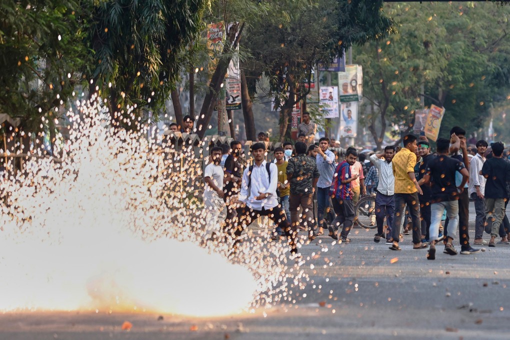 Police use stun grenades to disperse protesters outside the demolished residence of Sheikh Mujibur Rahman, Bangladesh’s former leader and father of ousted prime minister Sheikh Hasina, on Monday. Photo: AP