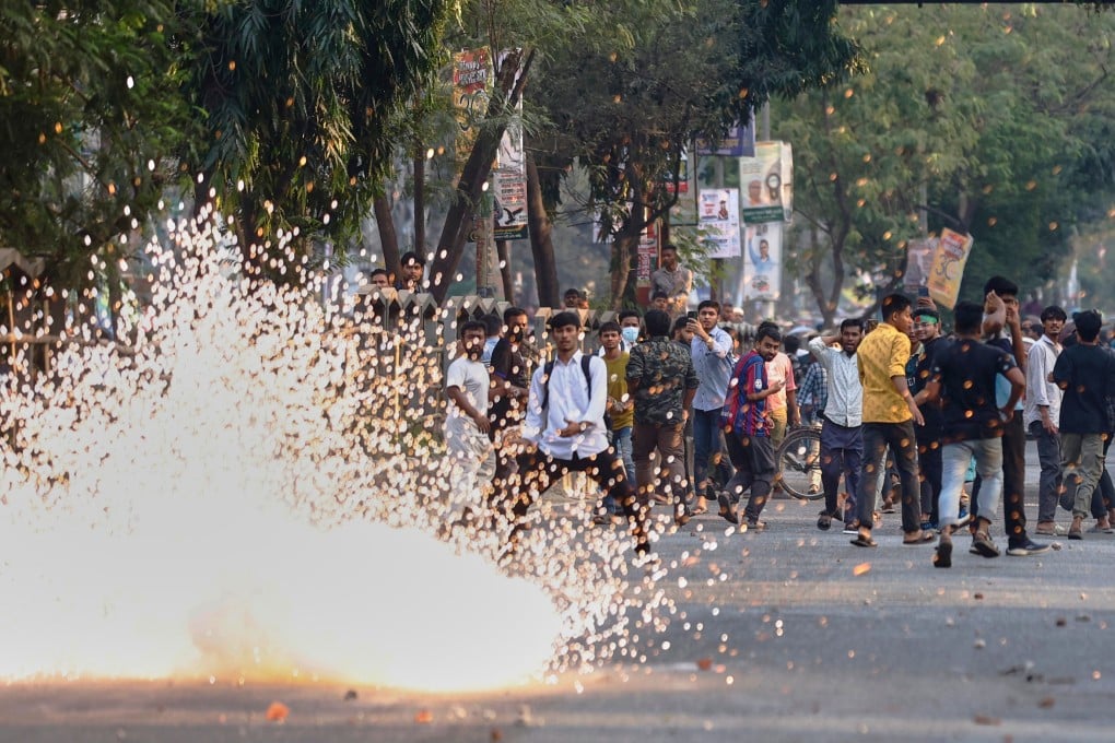 Police use stun grenades to disperse protesters outside the demolished residence of Sheikh Mujibur Rahman, Bangladesh’s former leader and father of ousted prime minister Sheikh Hasina, on Monday. Photo: AP