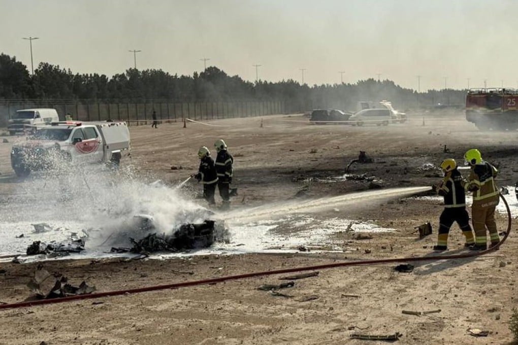 Firefighters work at the site of a crash involving an Indian-made HAL Tejas fighter jet on Friday. Photo: Government of Dubai Media Office/Reuters