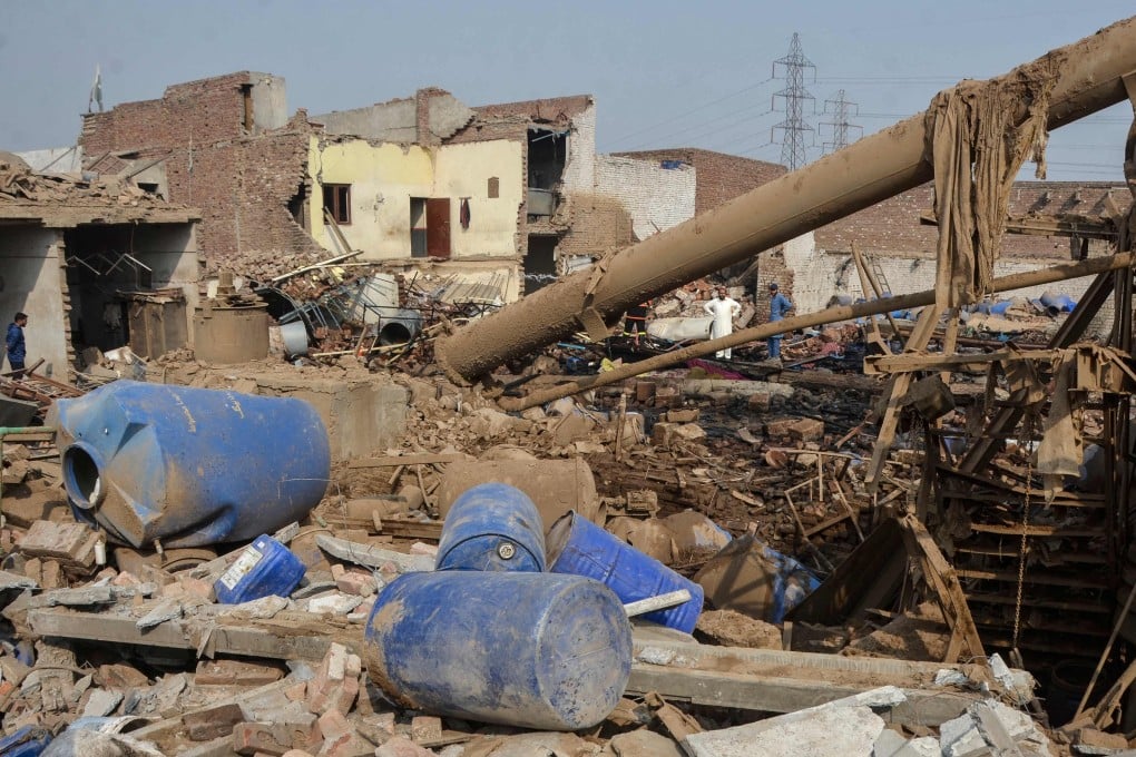 Rescuers search for survivors after an explosion at a glue-manufacturing factory in Faisalabad on Friday. Photo: AFP