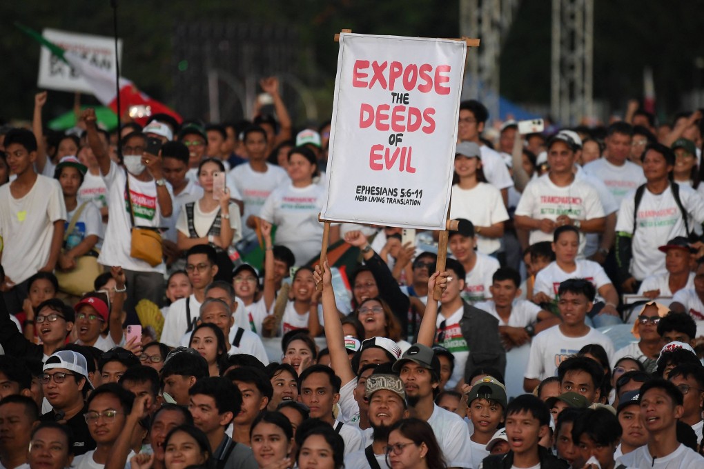 Members of the religious sect Iglesia ni Cristo listen to speeches during an anti-corruption protest at a park in Manila on Monday. The rally drew more than half a million church members. Photo: AFP