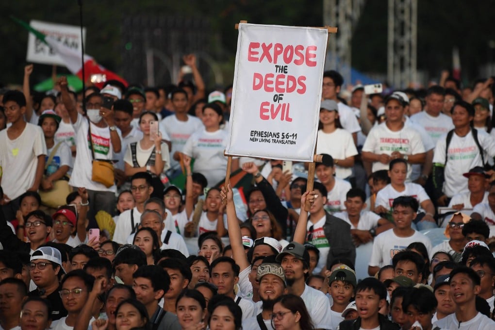 Members of the religious sect Iglesia ni Cristo listen to speeches during an anti-corruption protest at a park in Manila on Monday. The rally drew more than half a million church members. Photo: AFP