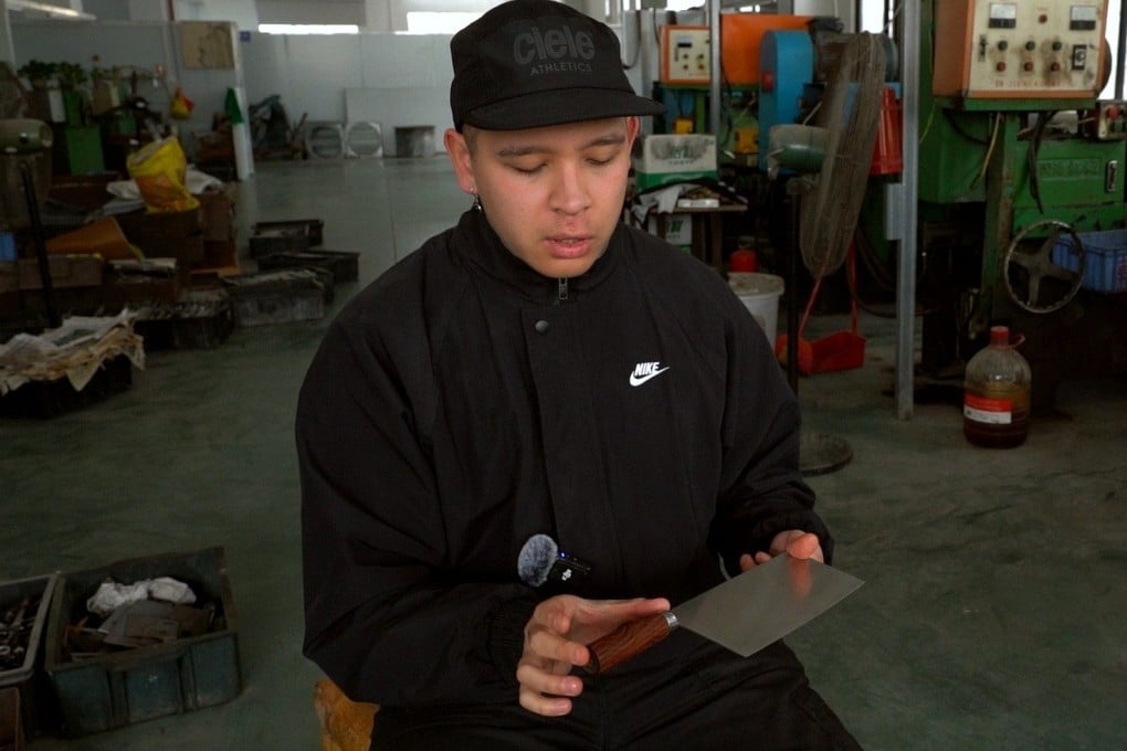 Sean Warmington-Wan examines one of his Chinese chef’s knives at a factory in Yangjiang, southern China. Photo: Fragrant Knives