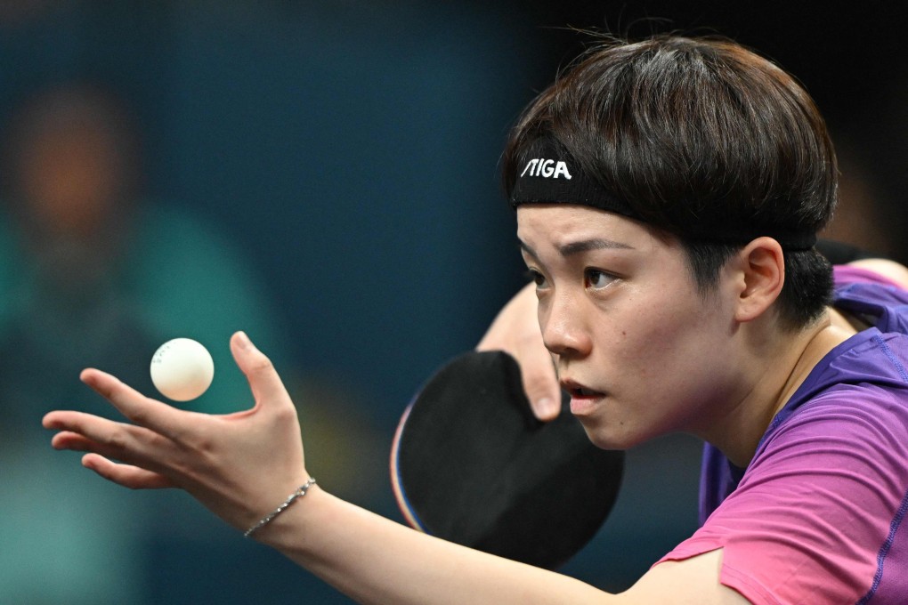 Hong Kong’s Doo Hoi Kem serves during her women’s table tennis singles match in the team round of 16 between Hong Kong and Sweden at the Paris 2024 Olympic Games at the South Paris Arena in Paris on August 5, 2024. (Photo by JUNG Yeon-je / AFP)