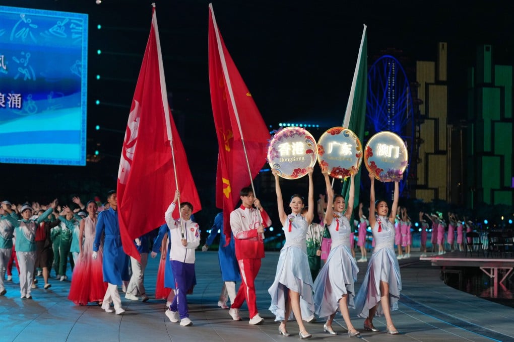 Members of the Guangdong province, Hong Kong and Macau delegations take part in the closing ceremony of the 15th National Games. Photo: Xinhua