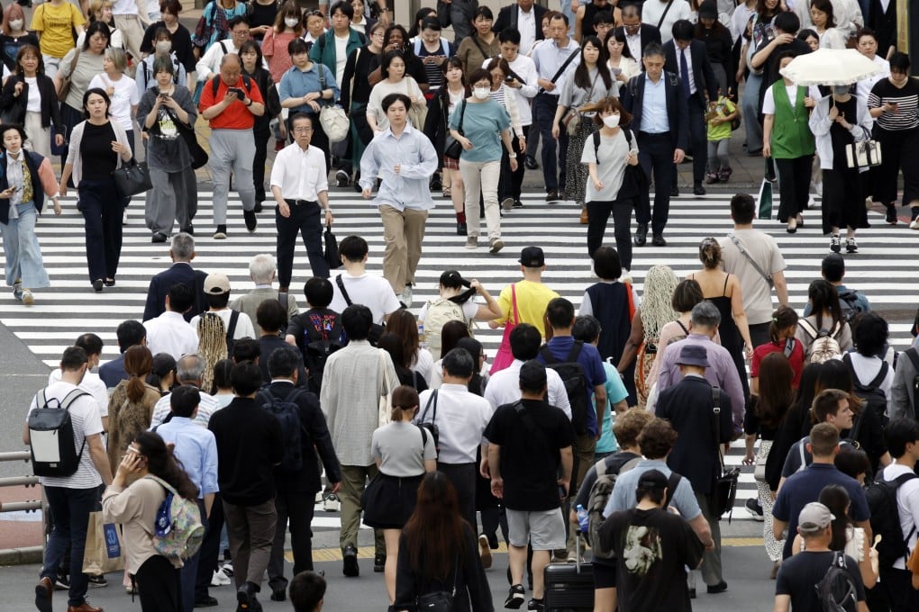 Pedestrians in Tokyo. Japan plans to increase its relatively low visa fees to levels similar to those in some Western nations. Photo: EPA-EFE