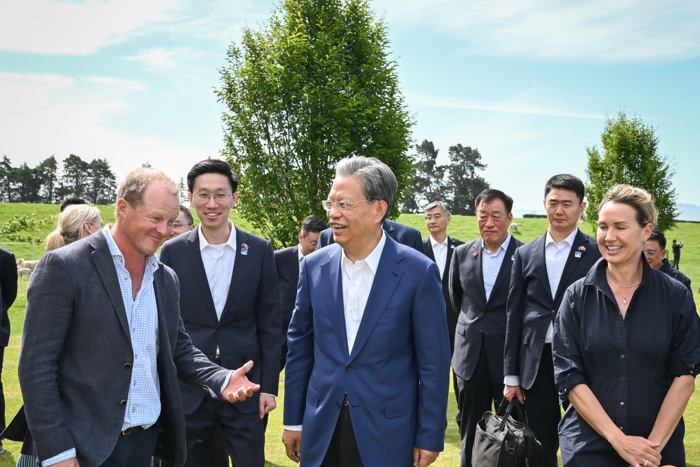 Zhao Leji (centre), chairman of China’s NPC Standing Committee, visits a local family at a farm in Christchurch, New Zealand, on November 21. Photo: Xinhua