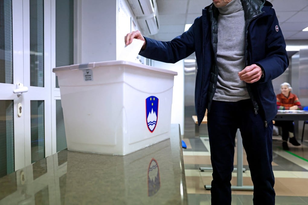 A person casts their ballot at a polling station in Ljubljana, Slovenia. Photo: Reuters