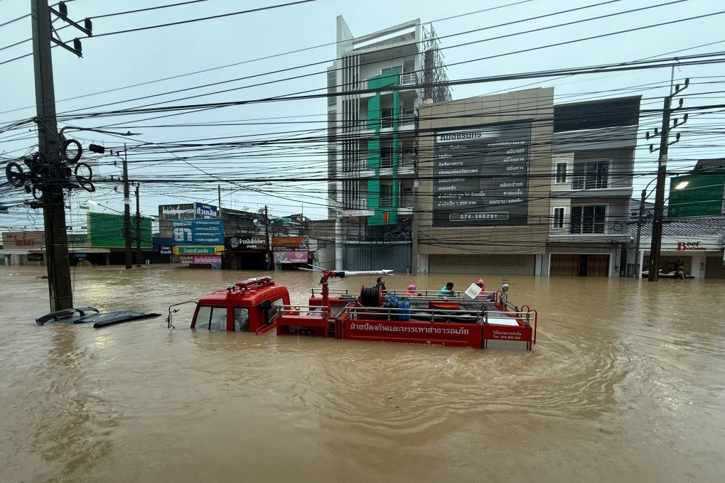 A fire truck is seen submerged in floodwaters in Songkhla province, southern Thailand, on Monday. The Cop30 summit set a goal of scaling up global climate finance to at least US$1.3 trillion per year by 2035. Photo: AP