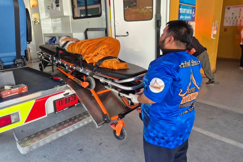 An emergency rescue team transport an elderly woman to a local hospital after she was found alive, having been declared deceased prior to her scheduled cremation on Sunday. Photo: Wat Rat Prakhong Tham/AP