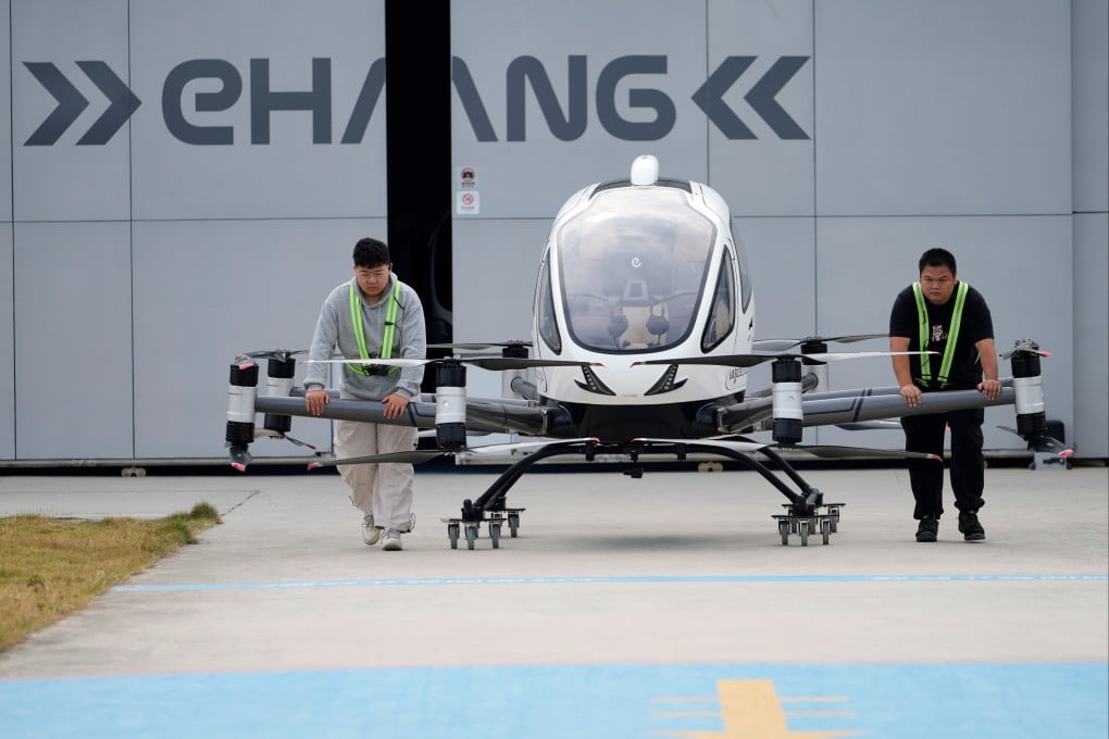 Workers prepare the EHang eVTOL EH126-S to fly in Guangzhou in southern China’s Guangdong province on November 3. Photo: AP