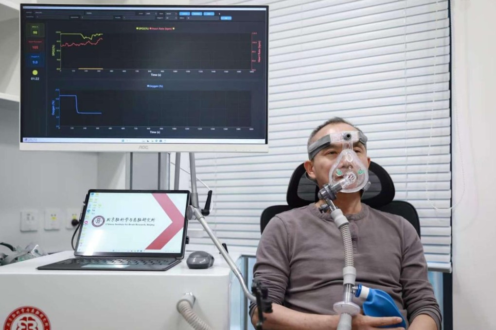 Luo Minmin from the Beijing Institute for Brain Research tests the acute intermittent hypoxia device developed by his team. Photo: Handout