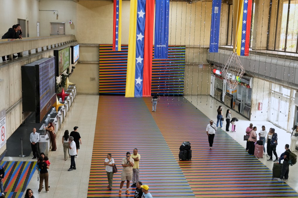 Travellers at Simon Bolivar Maiquetia International Airport in Maiquetia, Venezuela on Sunday after several international airlines cancelled flights following a warning from the US FAA. Photo: AP