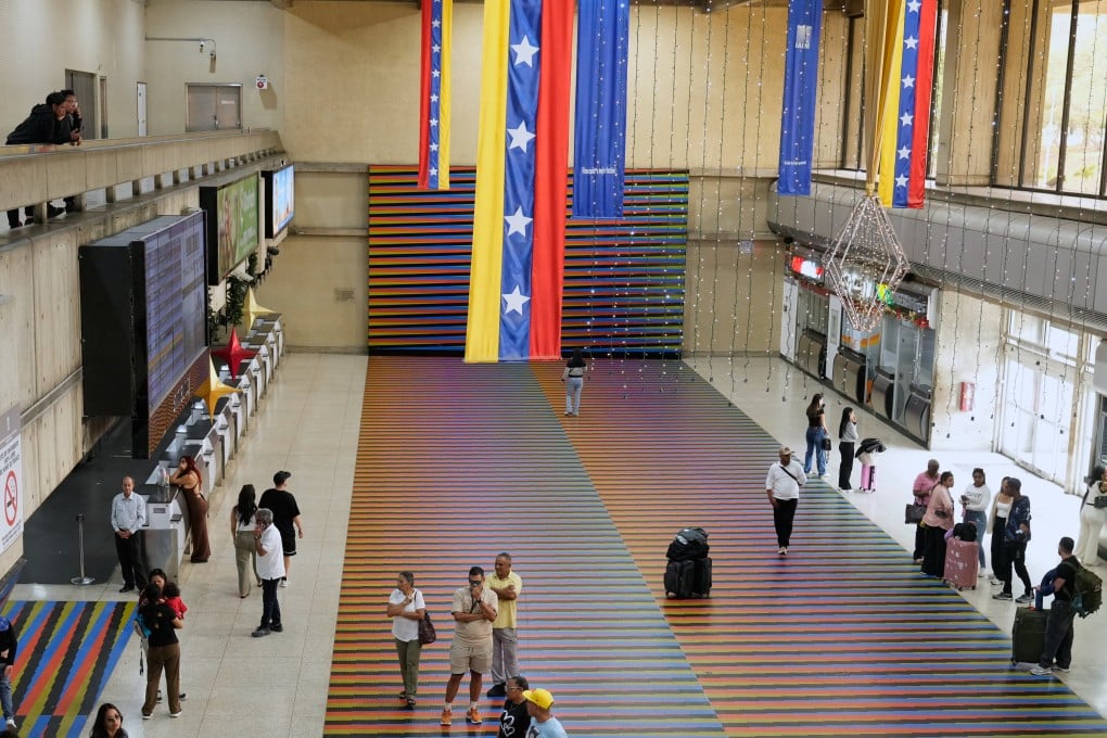 Travellers at Simon Bolivar Maiquetia International Airport in Maiquetia, Venezuela on Sunday after several international airlines cancelled flights following a warning from the US FAA. Photo: AP