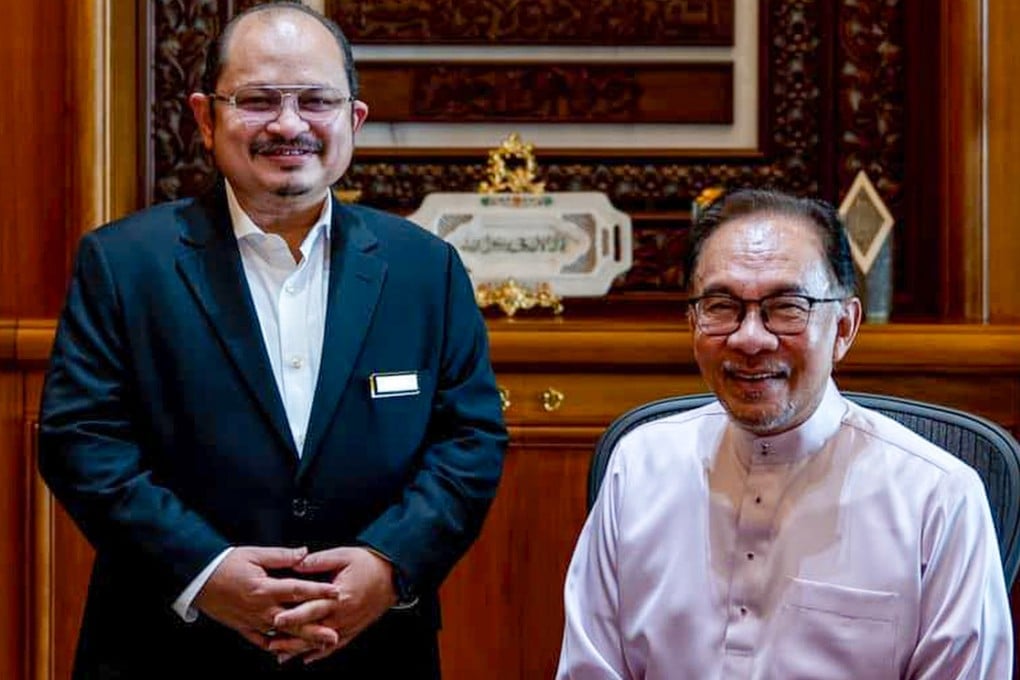Shamsul Iskandar (left), is pictured beside Malaysian Prime Minister Anwar Ibrahim. Photo: Handout