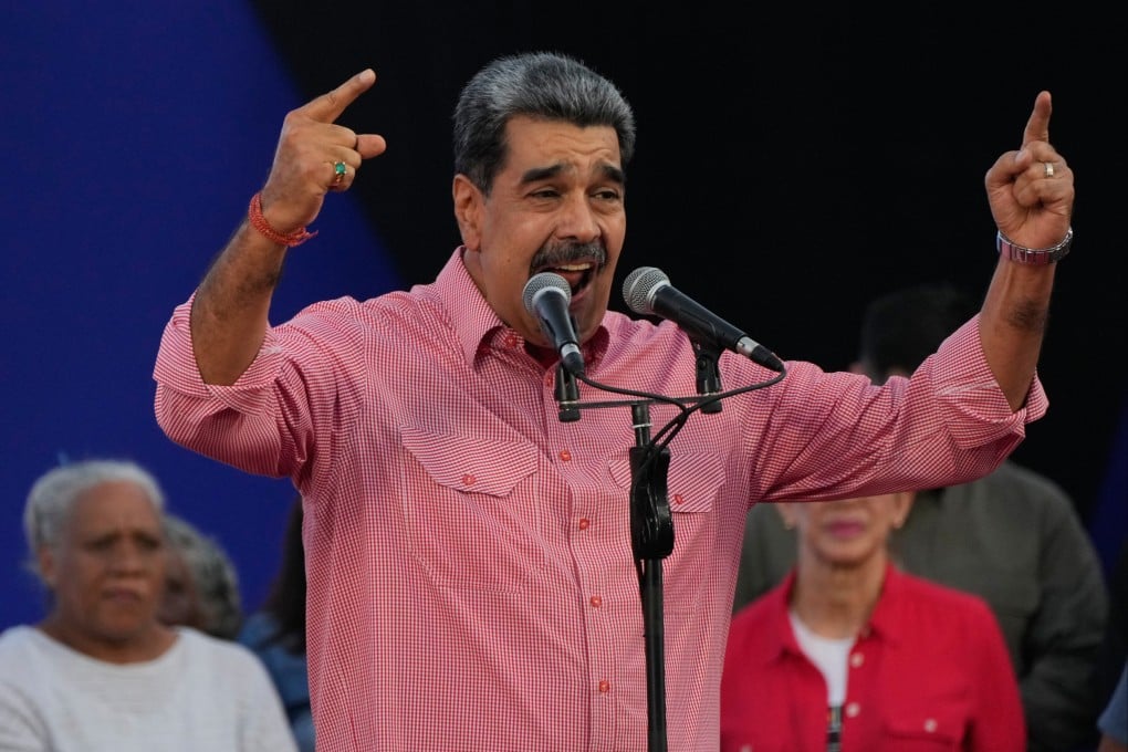 Venezuelan President Nicolas Maduro addresses civilians taking an oath to join a state-organised defence network on Saturday. Photo: AP