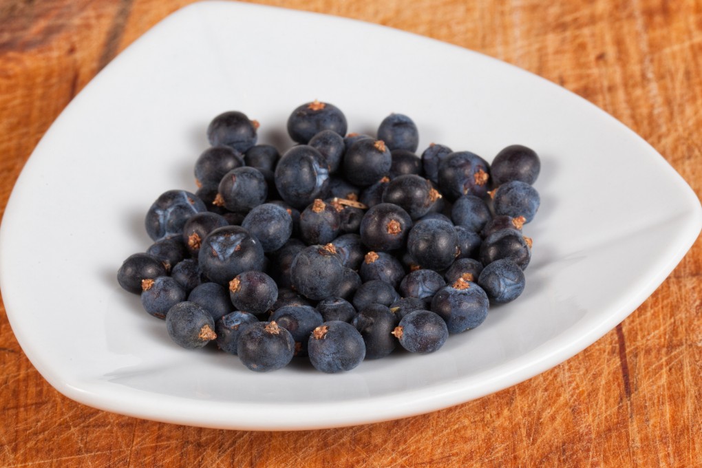 Juniper berries must be cracked or bruised to unleash their sharp, resinous flavour. Use them in marinades for venison and other gamey meats, or to add flavour to sauerkraut. Photo: Shutterstock