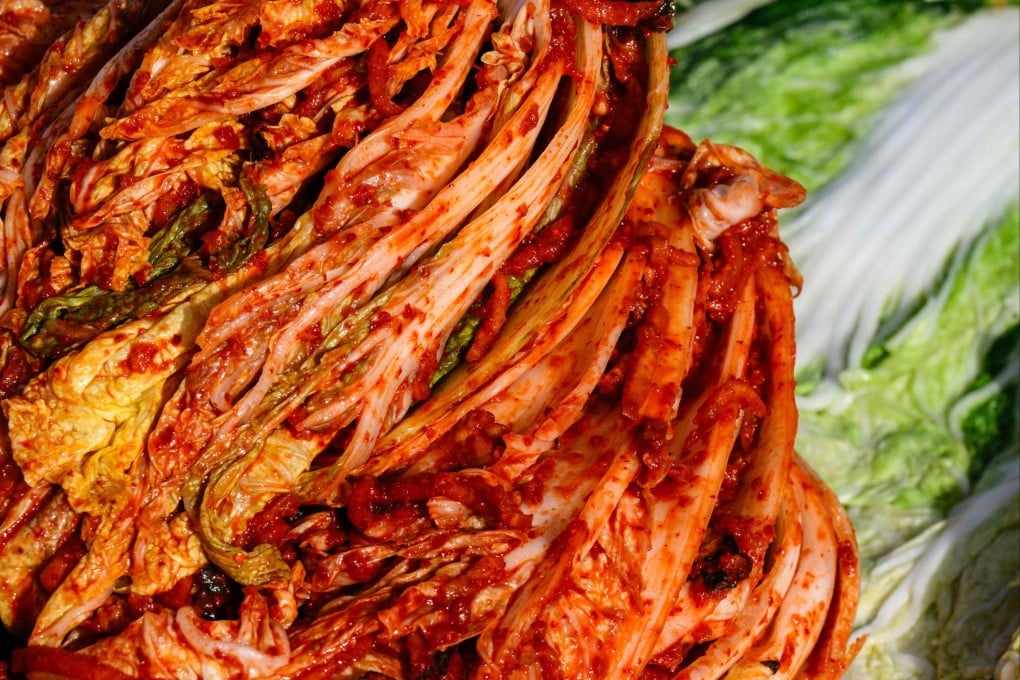 Freshly prepared kimchi is seen next to brined cabbage (right) during a kimchi-making festival at Garak Market in Seoul on November 17. Consumers from Japan to North America have embraced kimchi as a premium and increasingly health-focused product. Photo: AFP