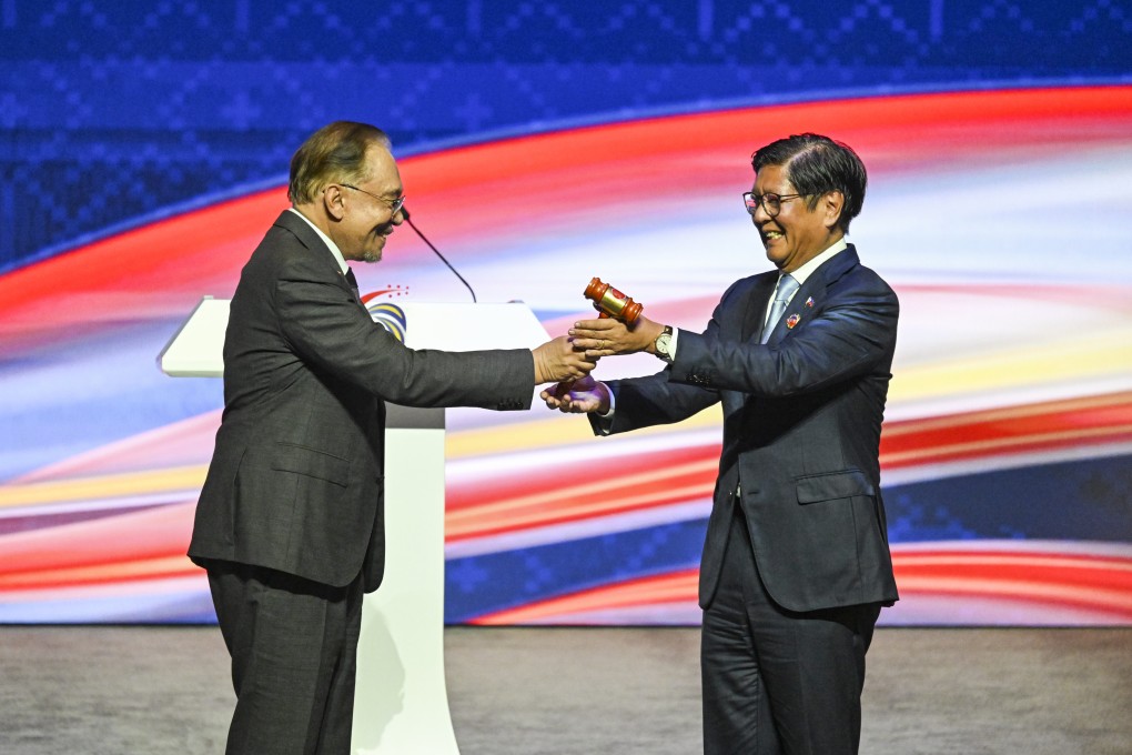 Malaysian Prime Minister Anwar Ibrahim hands the gavel over to Philippine President Ferdinand Marcos Jnr at the closing ceremony of the 47th Asean summit in Kuala Lumpur, Malaysia, on October 28. The Philippines takes over as Asean chair on January 1. Photo: Xinhua