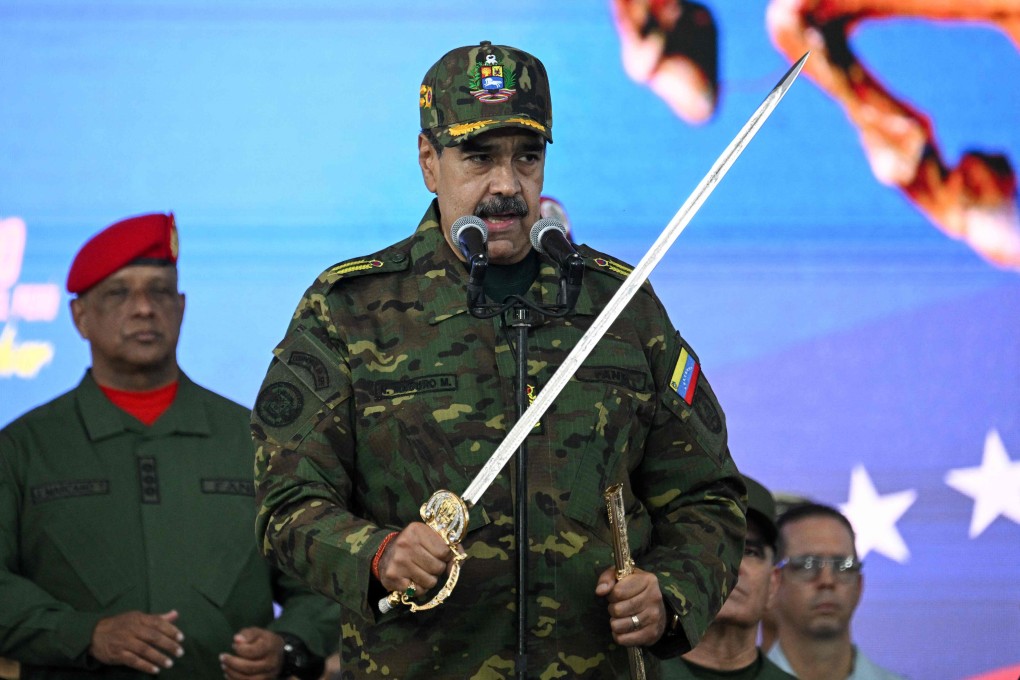 Venezuela’s President Nicolas Maduro delivers a speech while holding the Venezuelan independence hero Simon Bolivar’s ‘Sword of Peru’ during a military ceremony in Caracas on Tuesday. Photo: AFP