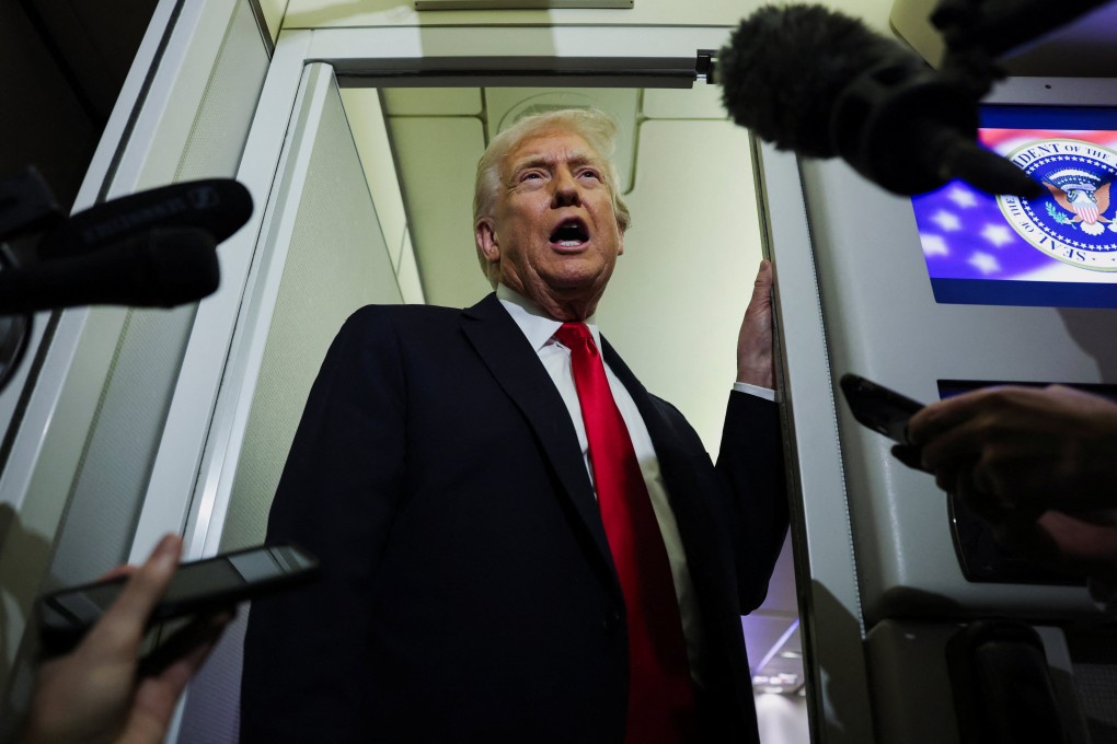 US President Donald Trump speaks to reporters aboard Air Force One on Tuesday. Photo: Reuters
