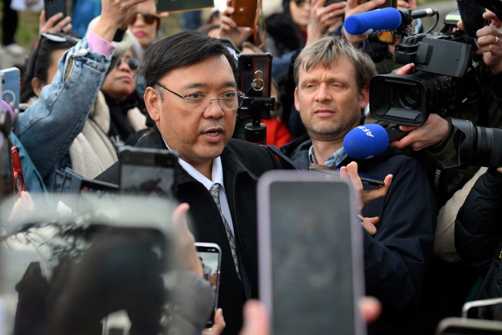 Harry Roque, a spokesman for ex-Philippine president Rodrigo Duterte, talks to journalists outside the International Criminal Court ahead of Duterte’s hearing in The Hague in March. Photo: AFP