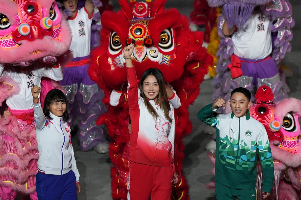 From the left, Hong Kong’s Ceci Lee Sze-wing, Guangdong’s Wang Xinyu and Macau’s Kuok Kin Hang celebrate at the closing ceremony of China’s 15th National Games, in Shenzhen on November 21. Photo: Xinhua