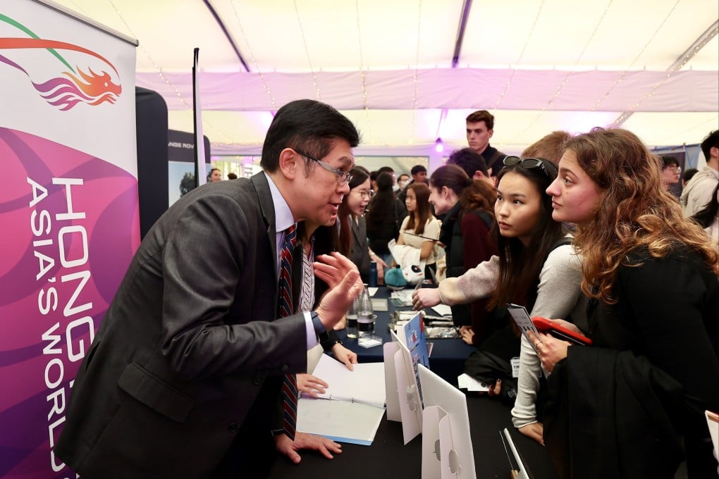 Leading the HKTE delegation, Andrew Tsang (left), deputy secretary for Labour and Welfare (Manpower), introduces Hong Kong’s various talent admission schemes to career fair participants.