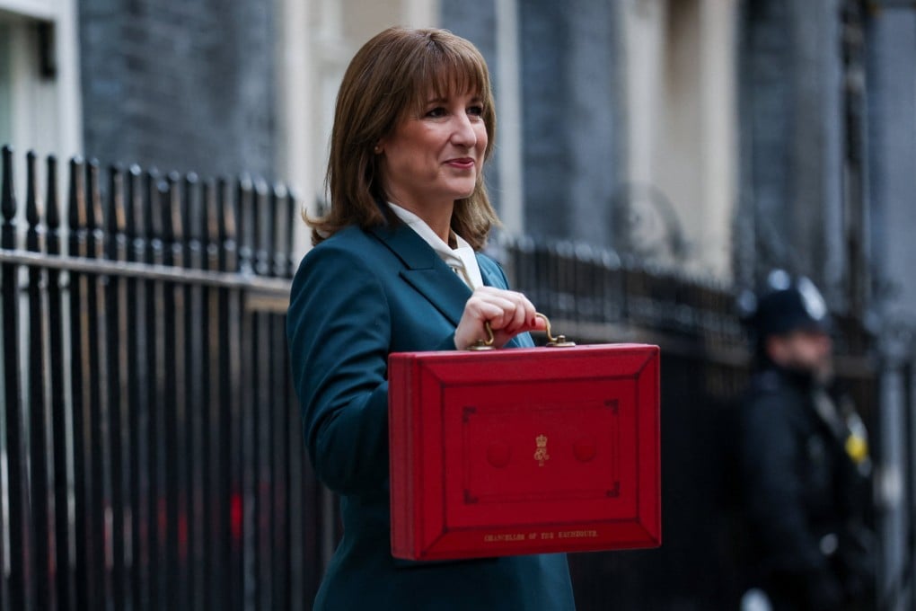 British Chancellor of the Exchequer Rachel Reeves poses with the red budget box outside her office in Downing Street in London, Britain on Wednesday. Photo: Reuters