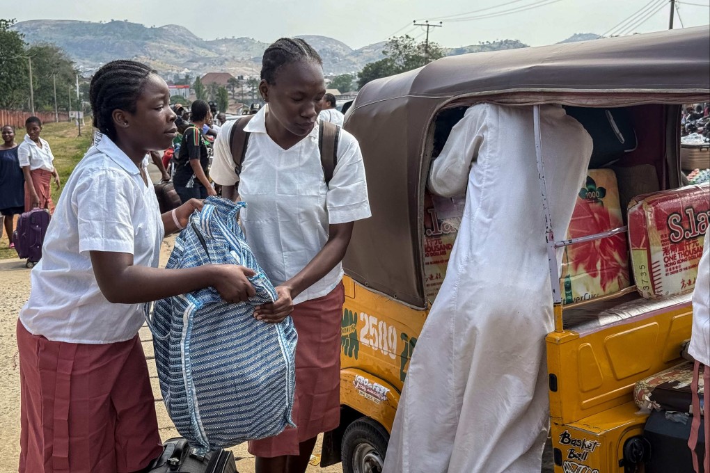 Students load bags into a vehicle outside the Federal Government Girls College in Bwari on Saturday. Nigeria’s education ministry ordered 47 boarding secondary schools across the country be shut after a mass kidnapping earlier in the week. Photo: AFP