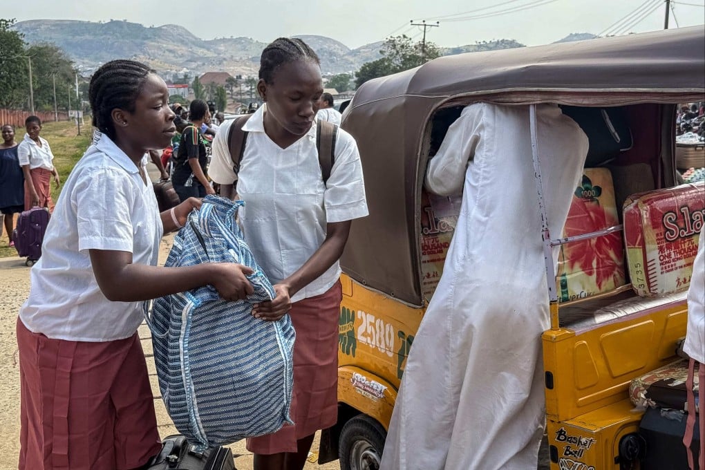 Students load bags into a vehicle outside the Federal Government Girls College in Bwari on Saturday. Nigeria’s education ministry ordered 47 boarding secondary schools across the country be shut after a mass kidnapping earlier in the week. Photo: AFP