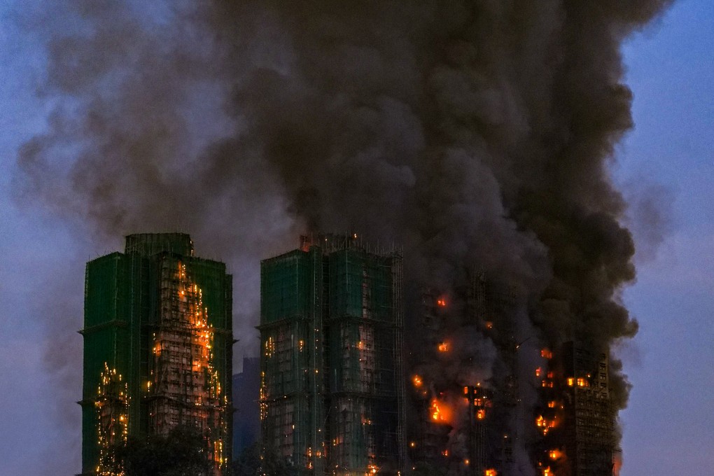 The blaze at Wang Fuk Court in Tai Po continues to burn into the evening. Photo: Eugene Lee