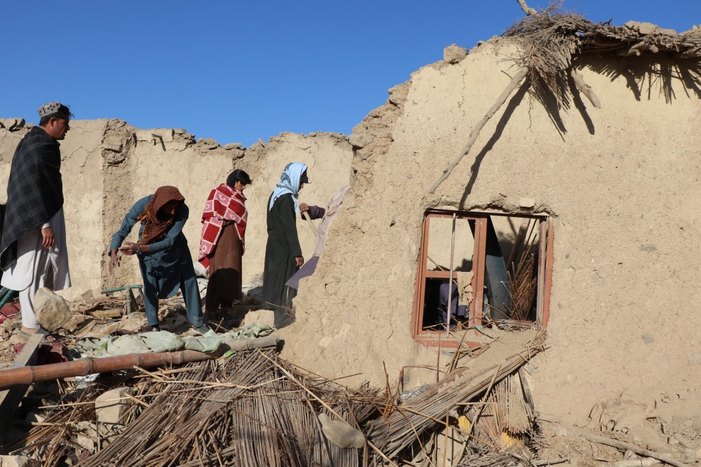 Residents clear debris from houses destroyed in air strikes in Khost, Afghanistan, on Tuesday. Photo: EPA