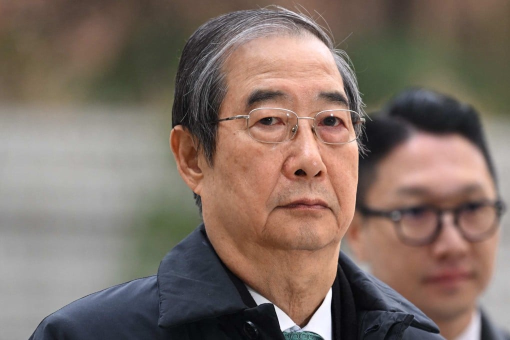 Former South Korean prime minister Han Duck-soo arrives at court for his final hearing on insurrection charges on Wednesday. Photo: AFP