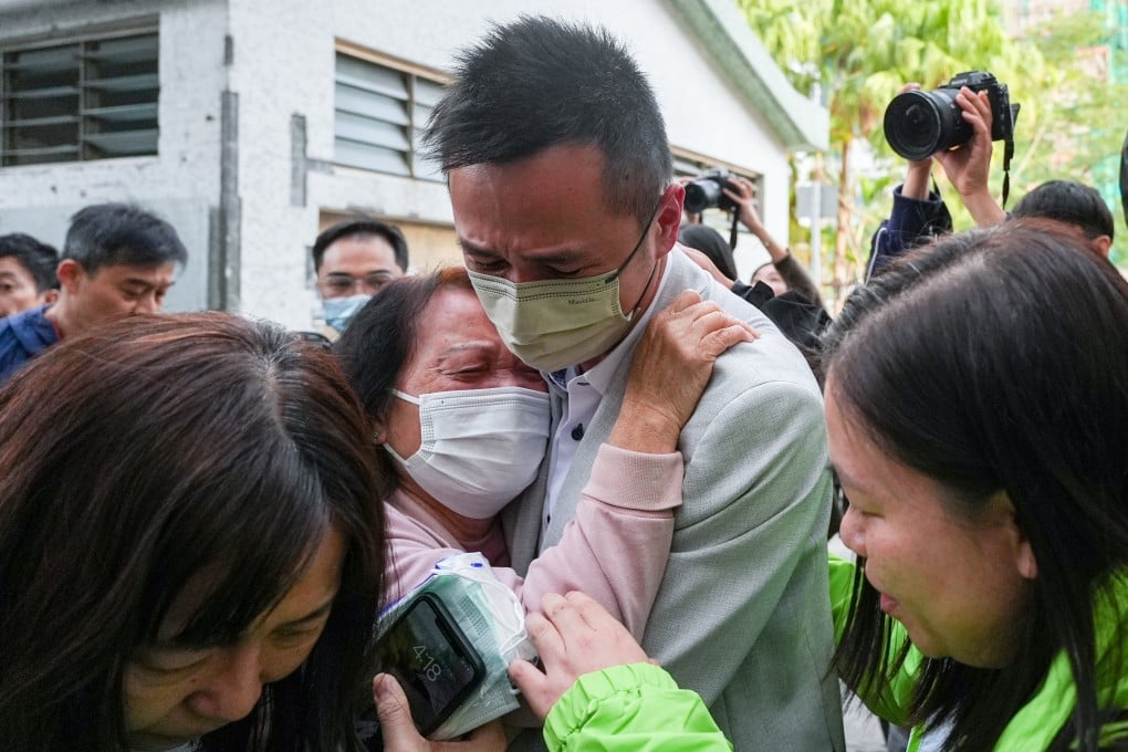 People weep after identifying their deceased relatives at Kwong Fuk Community Hall. Photo: Eugene Lee