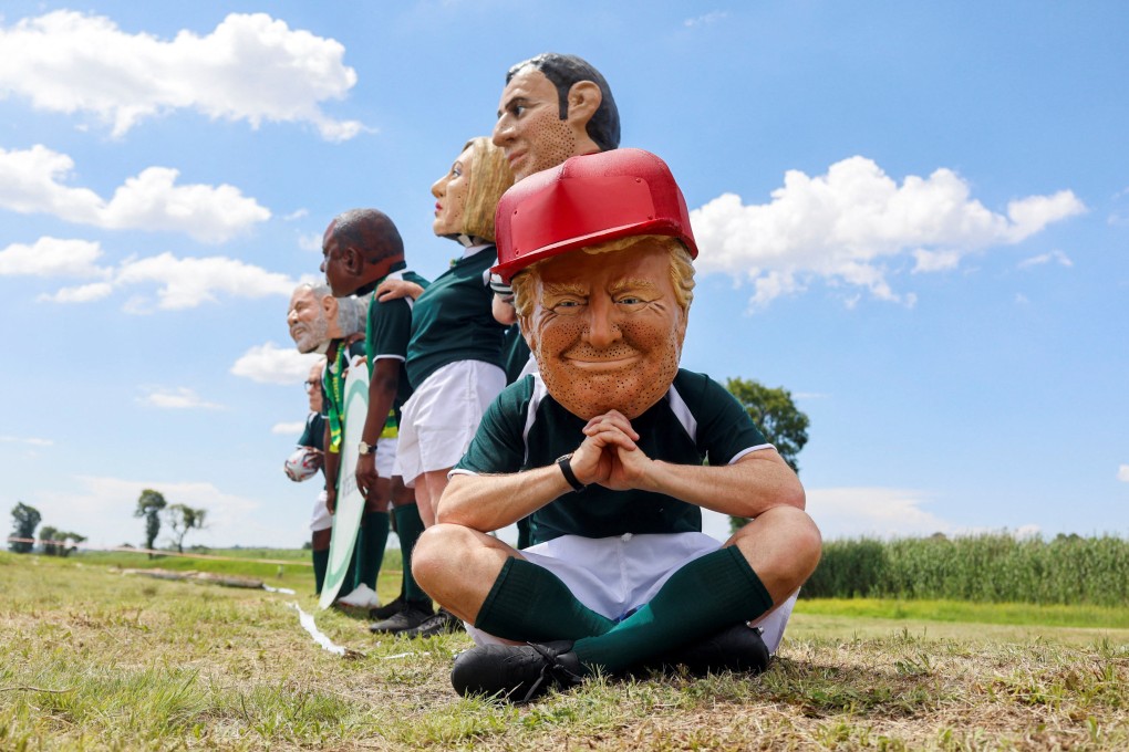 A protester wears a Trump mask, as Oxfam activists demanding the taxing of the super-rich in Johannesburg, South Africa, on Saturday, the opening day of the G20 leaders’ summit. Photo: Reuters