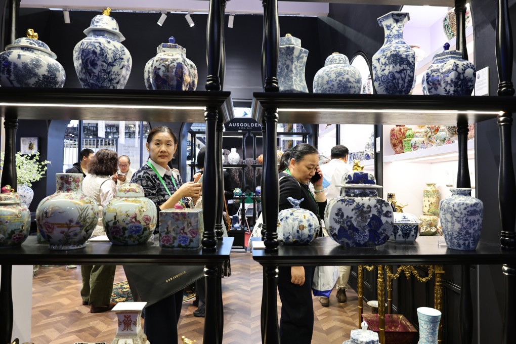 Visitors check out porcelain products in the consumer goods exhibition area at the China International Import Expo in Shanghai earlier this month. Photo: Xinhua