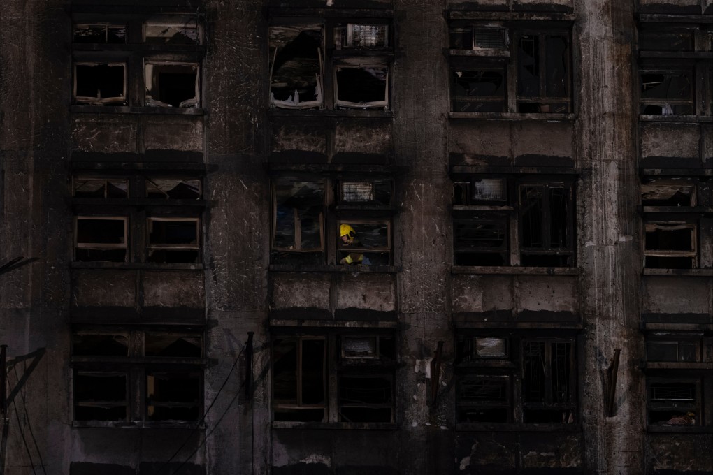 A firefighter searches through a building in the aftermath of the fire at Wang Fuk Court. The heroic efforts of Hong Kong’s firefighters and emergency services must be acknowledged. Photo: AP