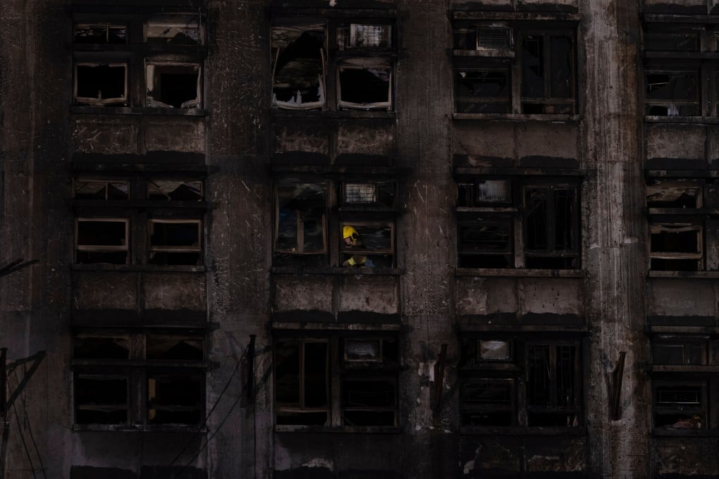 A firefighter searches through a building in the aftermath of the fire at Wang Fuk Court. The heroic efforts of Hong Kong’s firefighters and emergency services must be acknowledged. Photo: AP