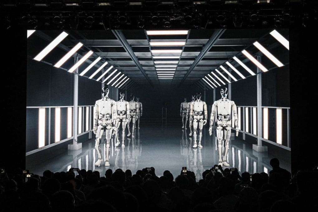 People watch a video clip of Xpeng’s second-generation Iron humanoid robot at the company’s Guangzhou headquarters on November 5. Photo: AFP