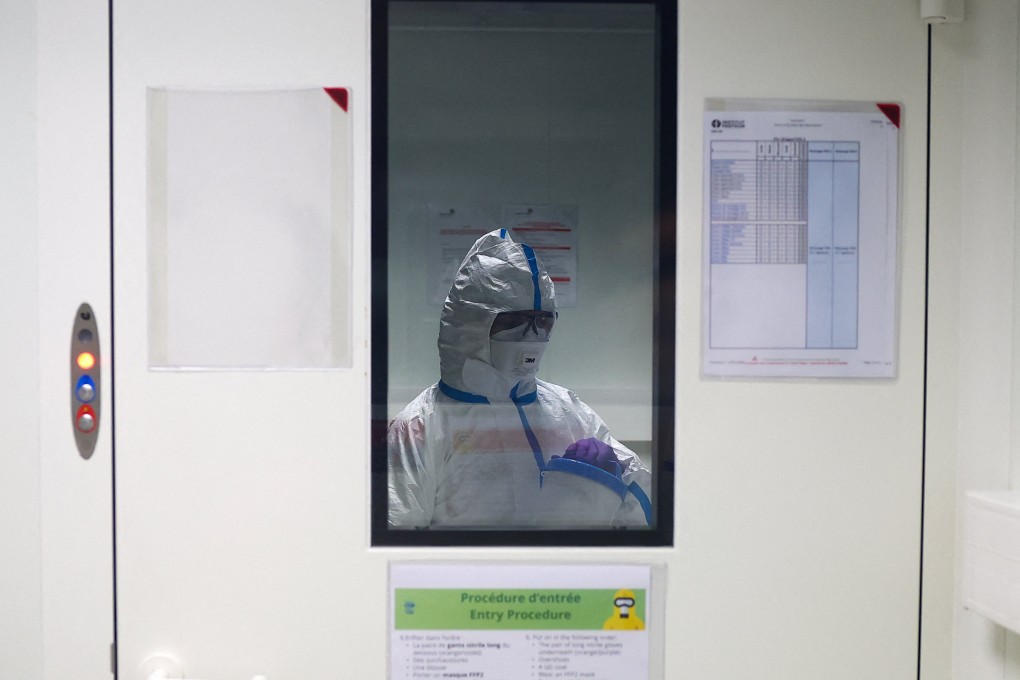 A researcher wearing a protective suit at the Institut Pasteur in Paris, where scientists work to monitor and prevent the spread of avian influenza. Photo: Reuters