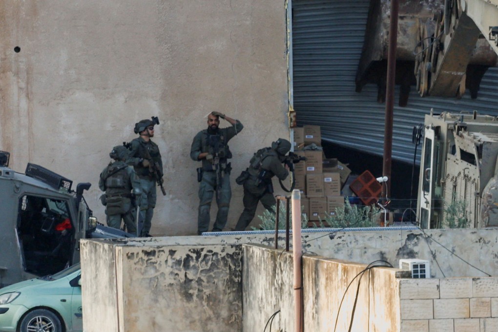 Israeli soldiers take position during a raid in Jenin in the West Bank. Photo: Reuters
