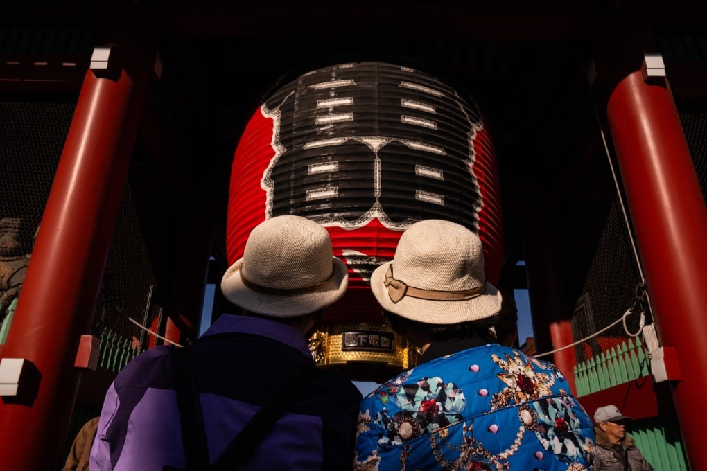 Chinese tourists visit the Sensoji temple in the Asakusa district of Tokyo on November 20. Many Chinese have chosen to cancel their trips to Japan after Beijing issued a travel advisory. Photo: AP