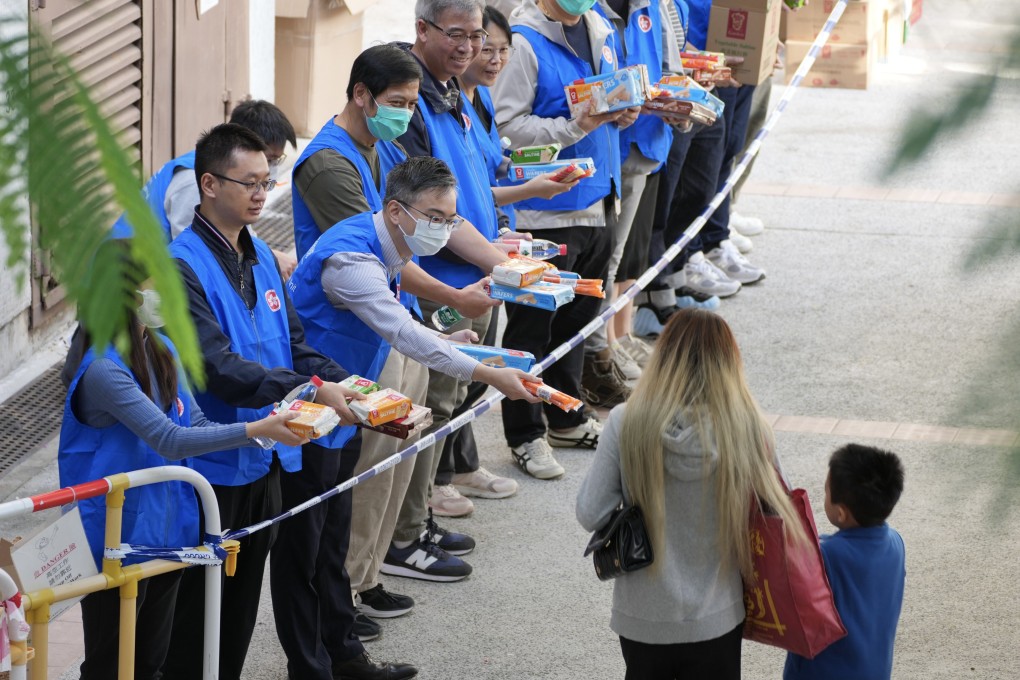 Government-backed care teams help distribute supplies in Tai Po. Photo: Karma Lo