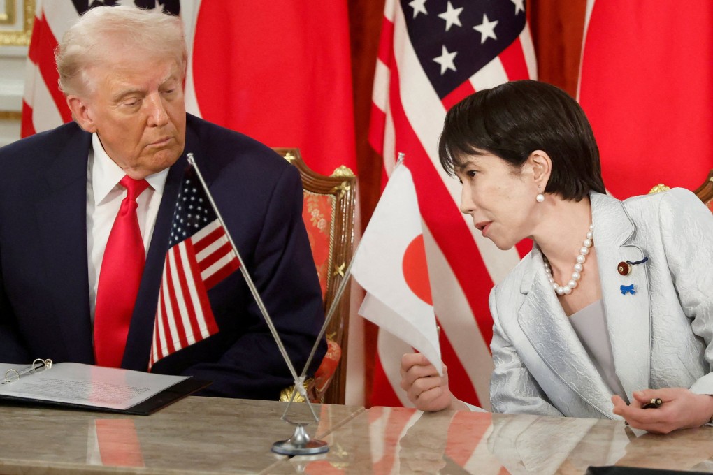 US President Donald Trump (left) and Japanese Prime Minister Sanae Takaichi talk during a US-Japan trade deal signing on October 28. Photo: Reuters