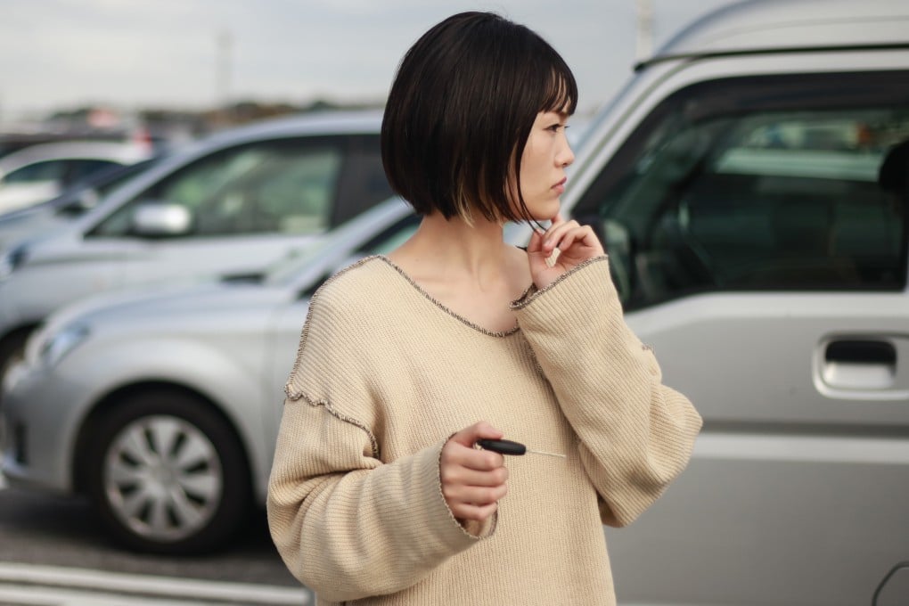 A woman looks for her car in a parking lot. Car thefts are on the rise in Japan. Photo: Shutterstock