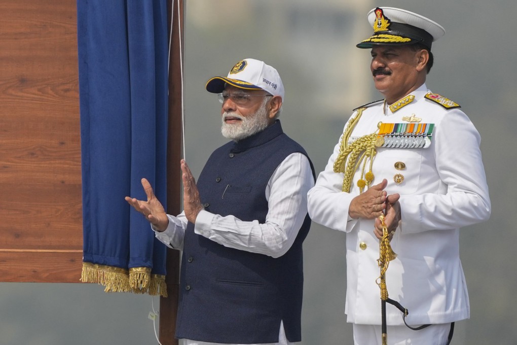 Indian Prime Minister Narendra Modi and Navy Chief Dinesh Kumar Tripathi (right) during a commissioning ceremony for three warships in Mumbai earlier this year. Photo: AFP