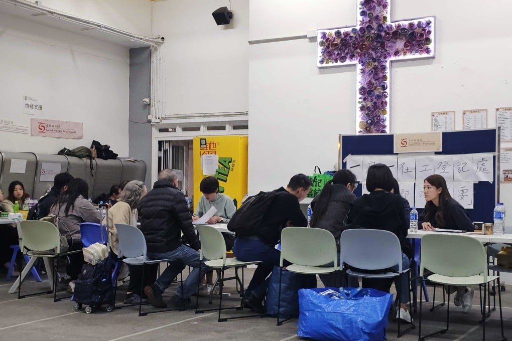 Fire victims apply for emergency aid at the Fung Leung Kit Memorial Secondary School. Photo: Edmond So