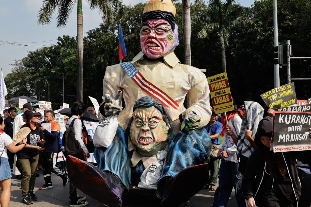 Protesters display an effigy of Philippine President Ferdinand Marcos Jnr and Vice-President Sara Duterte-Carpio during an anti-corruption rally in Manila on Sunday. Photo: EPA